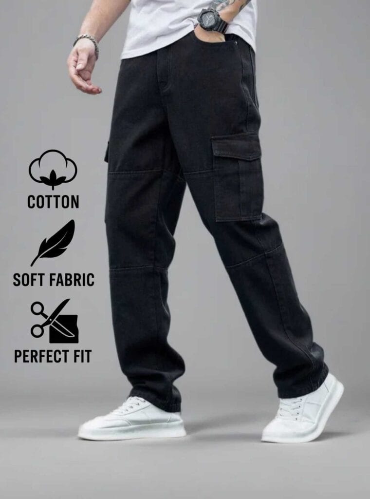 Man standing on a street wearing N Club black baggy cargo jeans with large flap cargo pockets on the thighs and a loose, comfortable fit